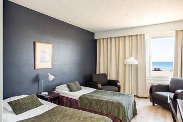 Фото номера Стандартный двухместный номер с 2 отдельными кроватями Отель Hotel Rantakalla г. Калайоки 2